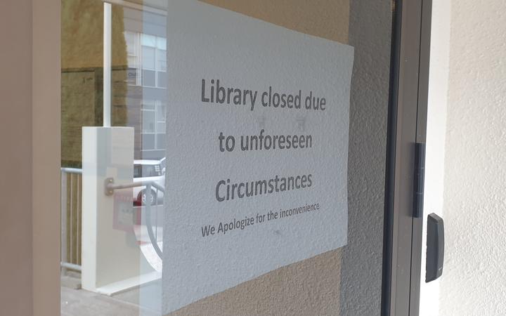 A sign states Napier Library has been closed.