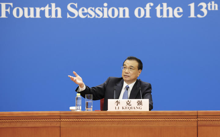 Chinese Premier Li Keqiang meets the press after the closing of the fourth session of the 13th National People's Congress at the Great Hall of the People in Beijing, capital of China, March 11, 2021.