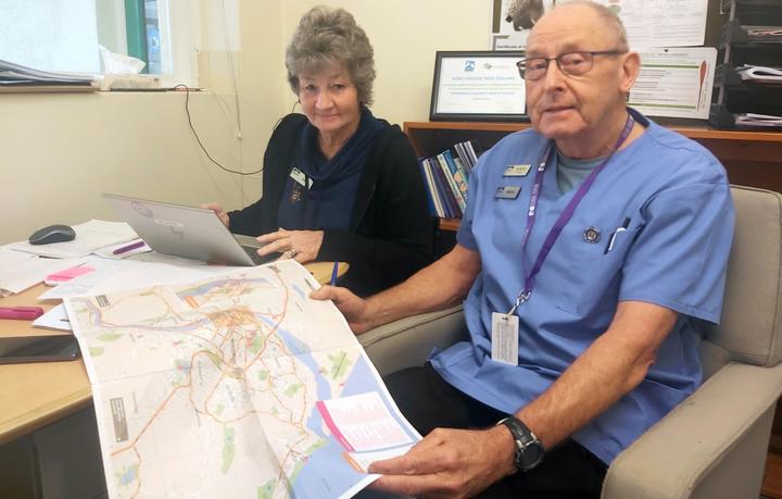 Nurses Julie Blair and Brian Elliott plot their route for the day's vaccinations.