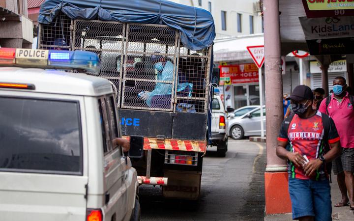 Police on patrol as they enforce face mask protocols in Fiji's capital Suva, amid a worsening outbreak of the Delta variant of Covid-19 in the Pacific nation.