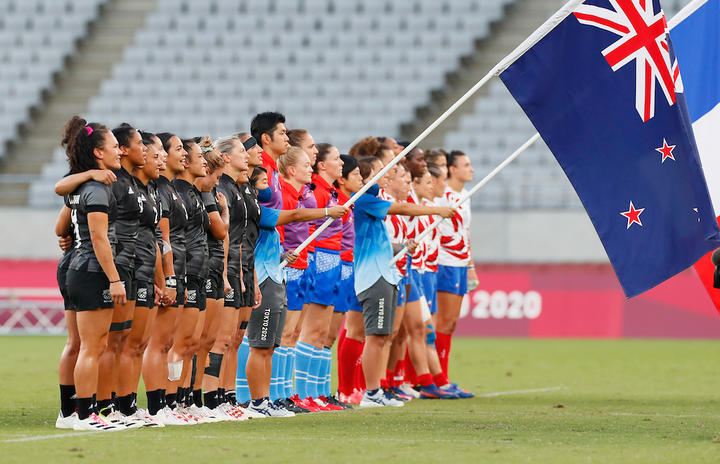 The Black Ferns women's sevens team and the French team stand for the anthems at the Tokyo Olympics, 31 July 2021