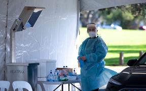 A health worker at the Devonport Covid-19 testing station.