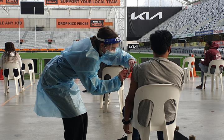 A person has a dose administered at the event.