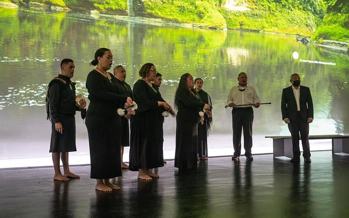 Whanganui River iwi members perform the tāngaengae ritual at dawn in the New Zealand Pavilion in Dubai.