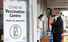 AUCKLAND, NEW ZEALAND - SEPTEMBER 16: People walk up to a vaccination centre on Dominion Rd, Balmoral on September 16, 2021 in Auckland, New Zealand.