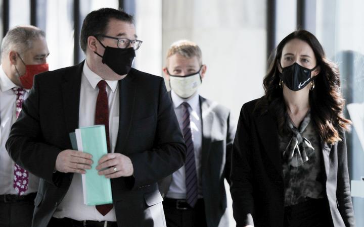 Grant Robertson and Jacinda Ardern arrive at Parliament for major briefing on Covid-19 