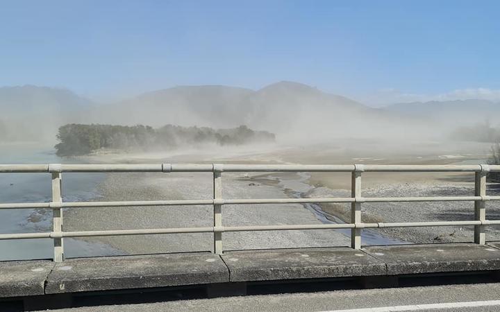 Clouds of dust rise off the Waiapu River and surrounds.