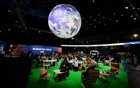 Delegates attend the third day of the COP26 UN Climate Summit in Glasgow, 3 November 2021.