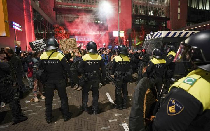 Two wounded as Dutch police fire shots at protest over new Covid  restrictions | RNZ News