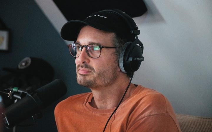 New Zealand journalist David Farrier records an episode of the Armchaired & Dangerous podcast