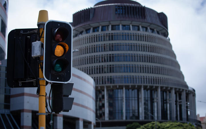 Orange Traffic Light in front of Parliament