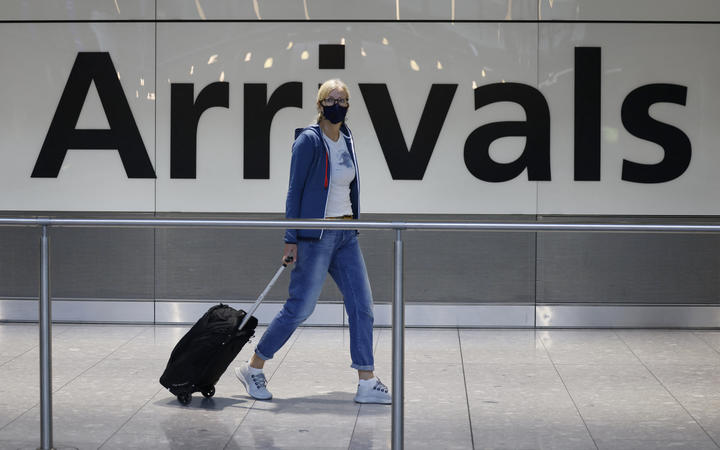 Travellers arrive at Heathrow's Terminal 5 in west London on 2 August, 2021 as quarantine restrictions ease.
