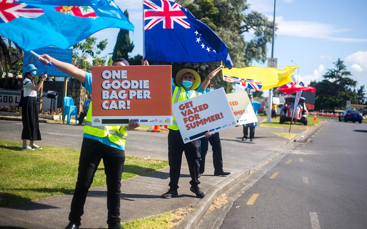 Fiji, Cook Islands, Niue and Tongan flags waved to passersby