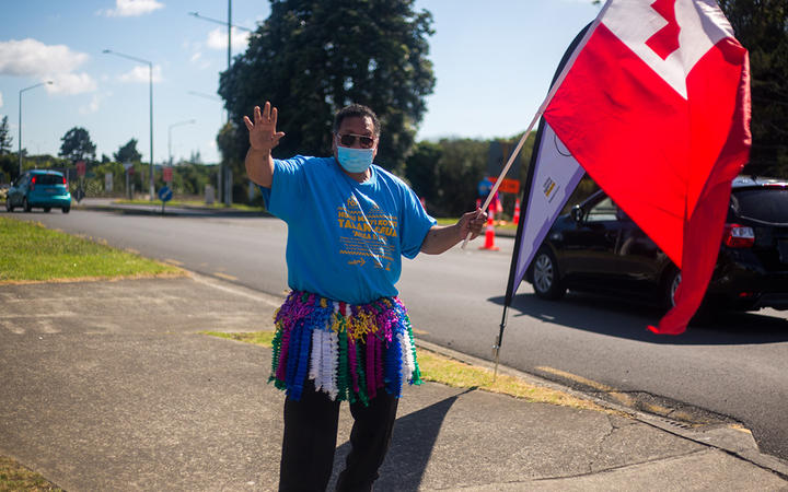 The Tongan flag is waved out the front of the Tokaikolo ‘Ia Kalaisi church in Māngere Bridge.