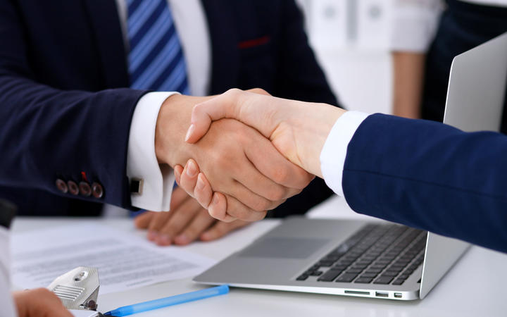 Business handshake at meeting or negotiation in the office. 