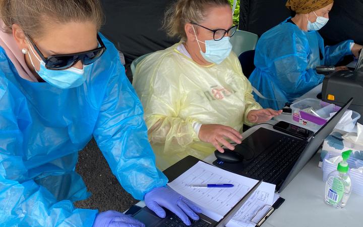 On the laptops at Ngāti Ruanui’s pop-up Covid-19 saliva testing station in Eltham were (from left) Tineka Kumeroa, Justine Stewart and Debbie Ngarewa-Packer.