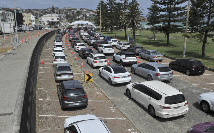 Residents queue up inside their cars for PCR tests at the St Vincent's Bondi Beach Covid-19 drive through testing clinic in Sydney.