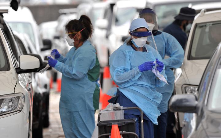 Health workers conduct PCR tests at the St Vincent's Bondi Beach Covid-19 drive through testing clinic on 22 December.