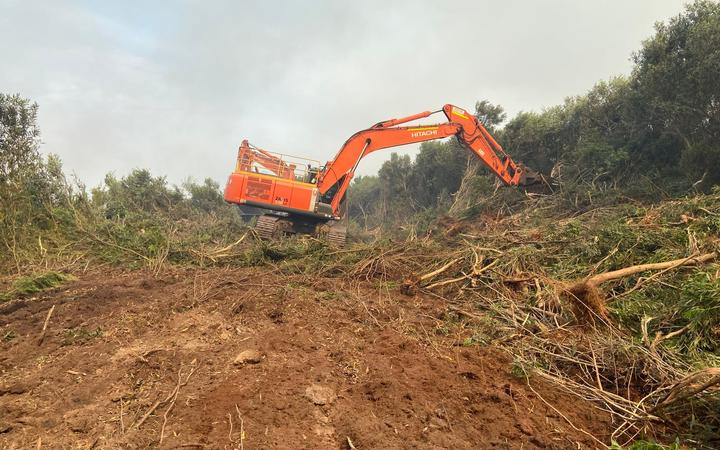 Heavy machinery was brought in to widen an existing track and create firebreaks, as well as around orchards, around Kaimaumau village on 20 December, 2021.