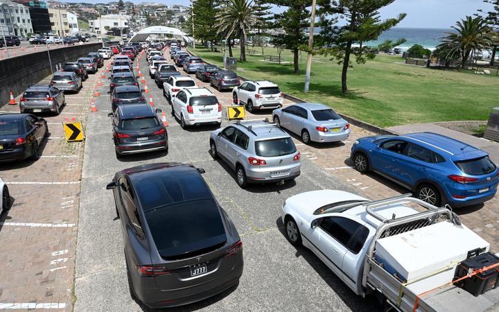 Residents queue up inside their cars for PCR tests at the St Vincent's Bondi Beach Covid-19 drive through testing clinic.