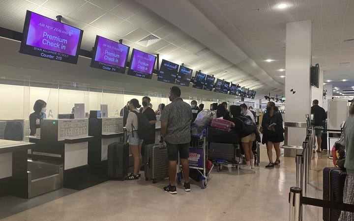 Passengers at check-in for the first flight to the Cook Islands.