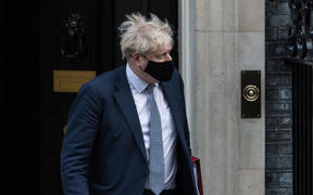 British Prime Minister Boris Johnson leaves 10 Downing Street on 12 January 2022.