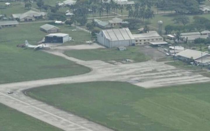 Fua'amotu International Airport has limited damage but a layer of ash covers the runway making it unusable. An aerial photo taken from an NZDF P-3 Orion on January 16, 2022 