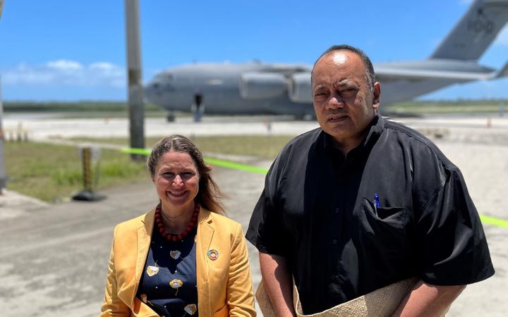 Tonga's Prime Minister Siaosi Sovaleni (right) joined by Australia's High Commissioner to Tonga Rachael Moore (left) to witness the arrival of the first Royal Australian Air Force C-17A Globemaster III aircraft from Australia delivering humanitarian assistance on January 20, 2022. 