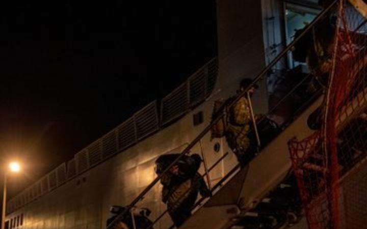 Defence Force personnel board the  HMNZS Canterbury.