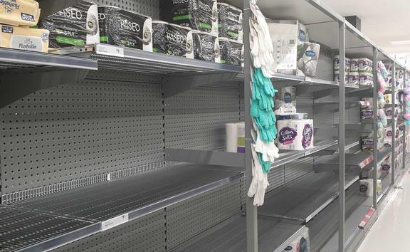 Shelves at Countdown, St Lukes, Auckland, were stripped of toilet paper following the announcement the country will move to red. 