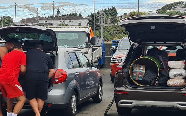 Families either brought their empty drums to pack onsite or brought them already filled