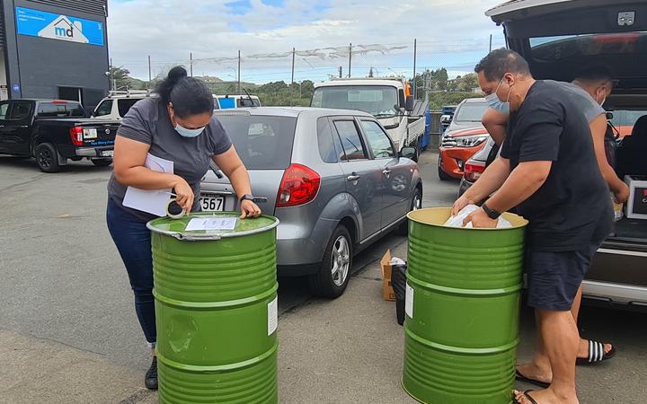 This family is packing their drums for family in Kolomotu'a