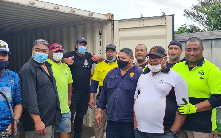 Loading the containers has been hard work as the supply barrels, many full of tinned food, are very heavy.  Fortunately, many local Tongan men in the area have turned up, often after finishing work, to complete the task.