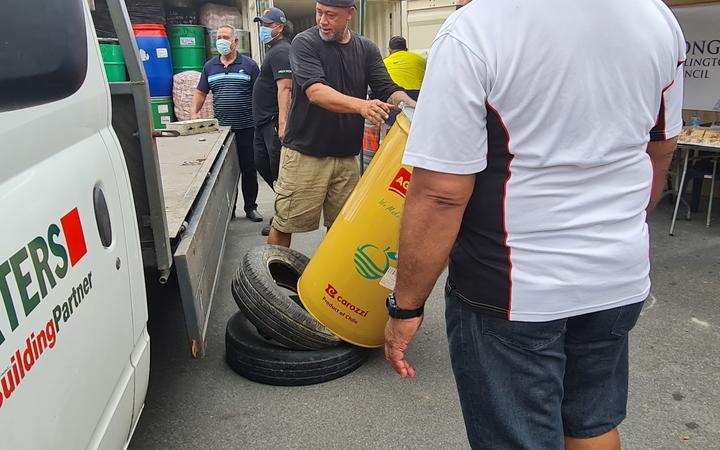 Each drum weighed over 100kgs as the men had no forklift to use - two tyres were were placed on the ground to take the impact of the drums when they were taken off a vehicle.