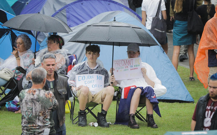 Protesters prepare for forecast wet weather in Wellington.