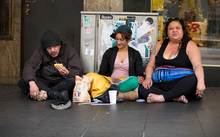 A group of people begging on Auckland's Queen Street.