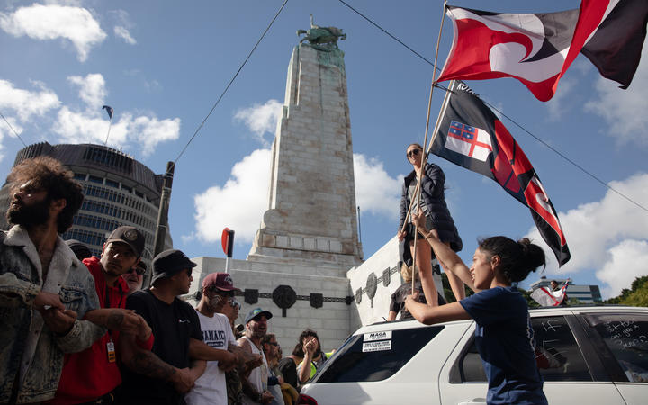 Protesters and police in standoff as police move concrete barricades