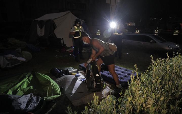 Police ripped down tents at the protest in the early hours of the morning.