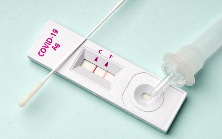 Rapid test device for COVID-19 virus with a positive result.