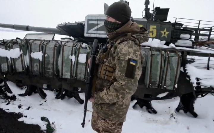 shows soldiers from the 93rd Kholodny Yar Brigade stand guard after they ambushed a Russian column in the north of Kharkiv region. 