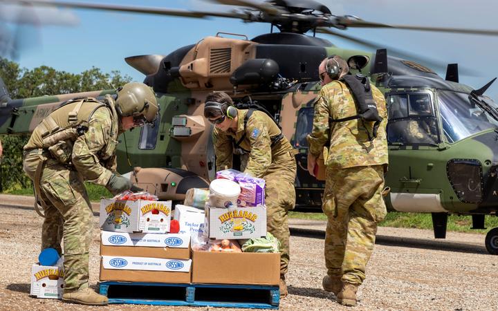 Australian Army soldiers loading crates of fresh food, ready for delivery to areas of northern New South Wales affected by floods on 4 March 2022.