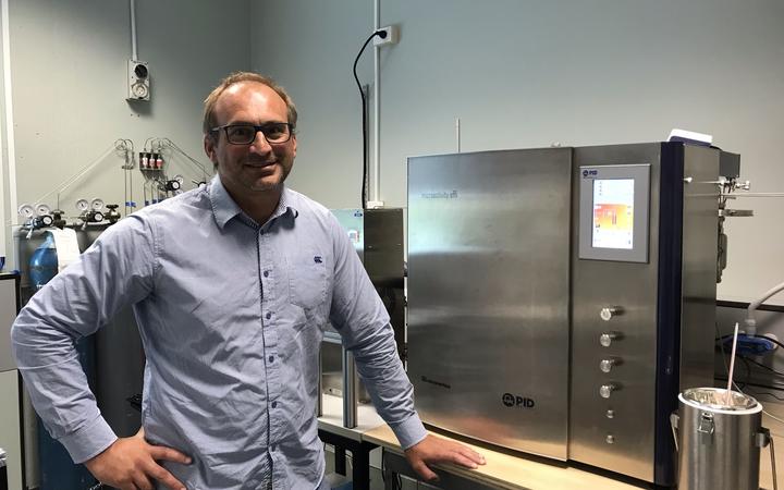Dr. Franck Natali beside the ammonia reactor. 