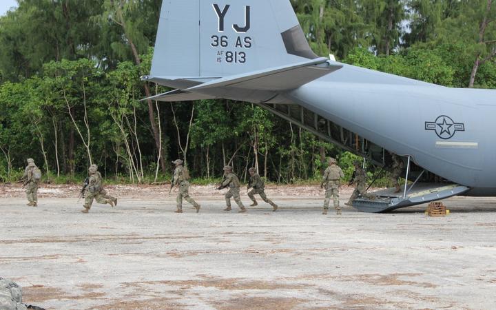 A US Air Force C-130 Hercules delivering US Army Pacific Soldiers onto Palau's Angaur Airfield.