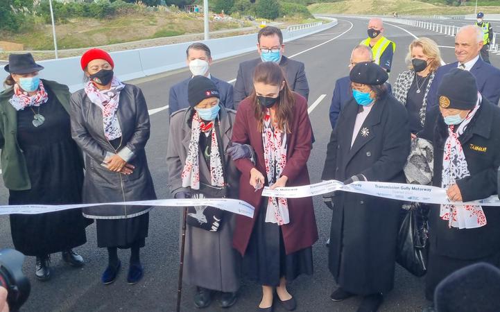 Prime Minister Jacinda Ardern cuts the ribbon on Transmission Gully during the opening ceremony, 30 March 2022.
