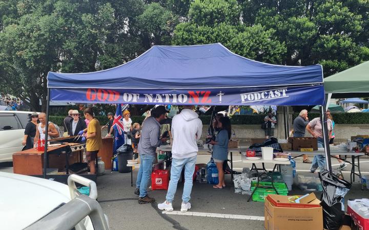 A sausage sizzle and coffee and tea station, with a generator being set up for protesters. 