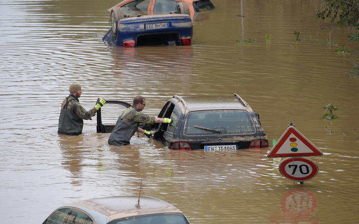 Soldiers search for flood victims in submerged vehicles on a federal highway in Erftstadt, western Germany. on 17 July 2021, after heavy rains hit parts of the country, causing widespread flooding and major damage. 
