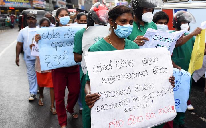 Doctors, paramedics and workers of Maussakalay hospital at Hatton in Sri Lanka protesting over the country's economic crisis on 8.4.22. 