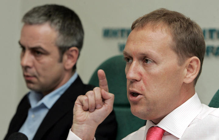 Russian businessmen Andrei Lugovoi (right), a former KGB officer, flanked by his business partner Dmitry Kovtun (left), speaks during a press conference in Moscow, 31 May 2007.