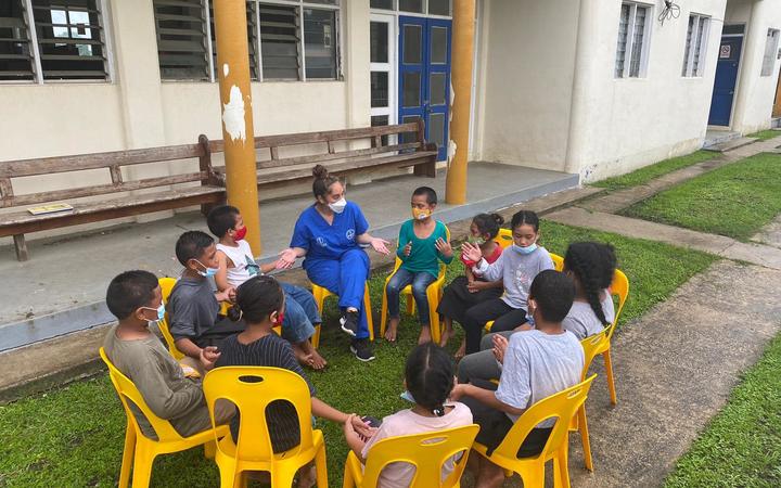 PACMAT nurse Mary-Rose Muller with children from Mango Island