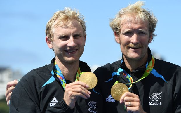 Hamish Bond, left, and Eric Murray celebrate with their gold medals on the podium after wining the Men's Pair Final of the Rowing events of the Rio 2016 Olympic Games at Lagoa Stadium in Rio de Janeiro, Brazil, 11 August 2016. 